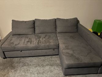 Gray couch turns into bed