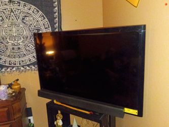 Tv with sound bar and woofer