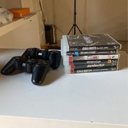 PS3 With Remotes And Games. 