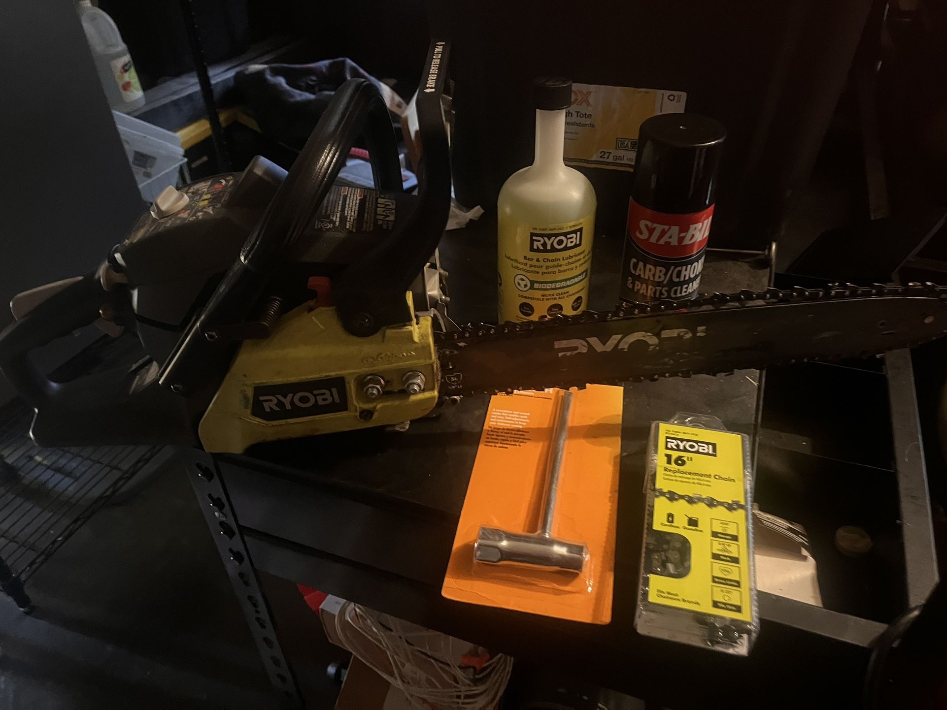 16” Ryobi Chainsaw W/ New Chain, Bar Oil, And Chainsaw Tool