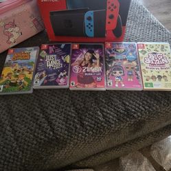 Nintendo switch with 5 games and case