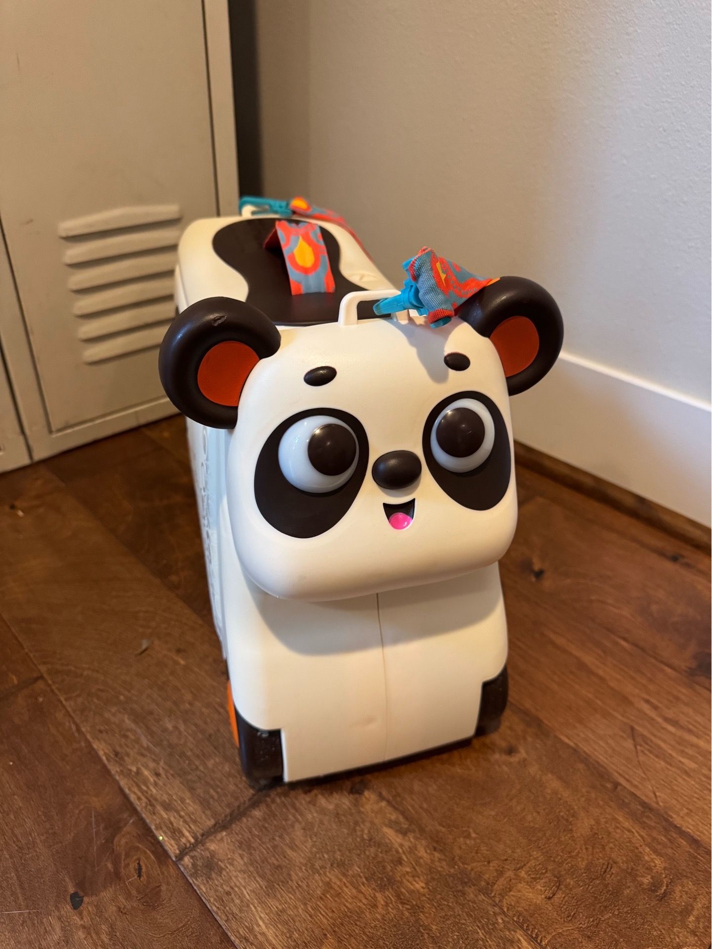 B. toys Ride-On Bingo the Panda Suitcase
