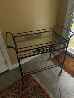 Wrought iron tea art on wheels