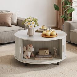 C234 $70  31.5" Modern Round Coffee Table With 360° Curved Sliding Door  Other Dimensions Cabinet Interior 11.8'' H X 31.5'' D Overall Dimensions 15.7