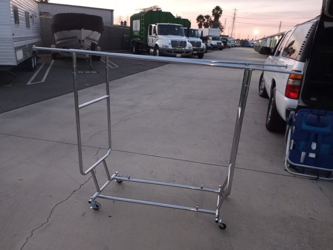 Used Double Clothing Rack With Wheels