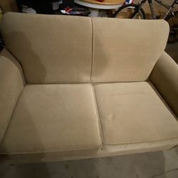 Love seat And Couch.. more of a beige or tan color