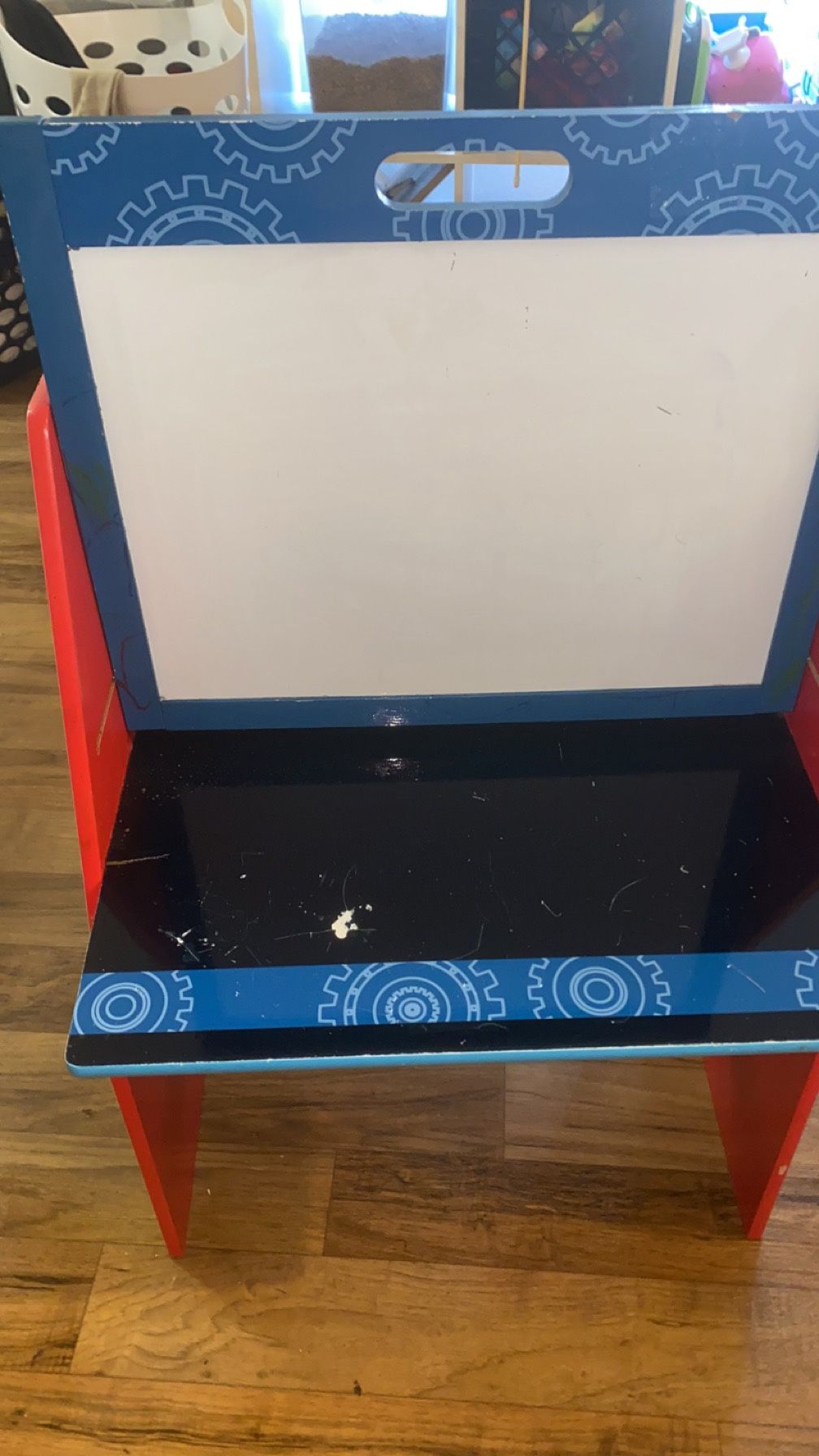 disney toddler desk with whiteboard and book cubbies in back.