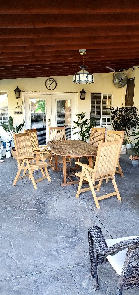 #1 Oval Patio solid Teak dining set with extended leaf, 6 folding adjustable Armchairs. 89"L, 40"W, 29"H Excellent condition