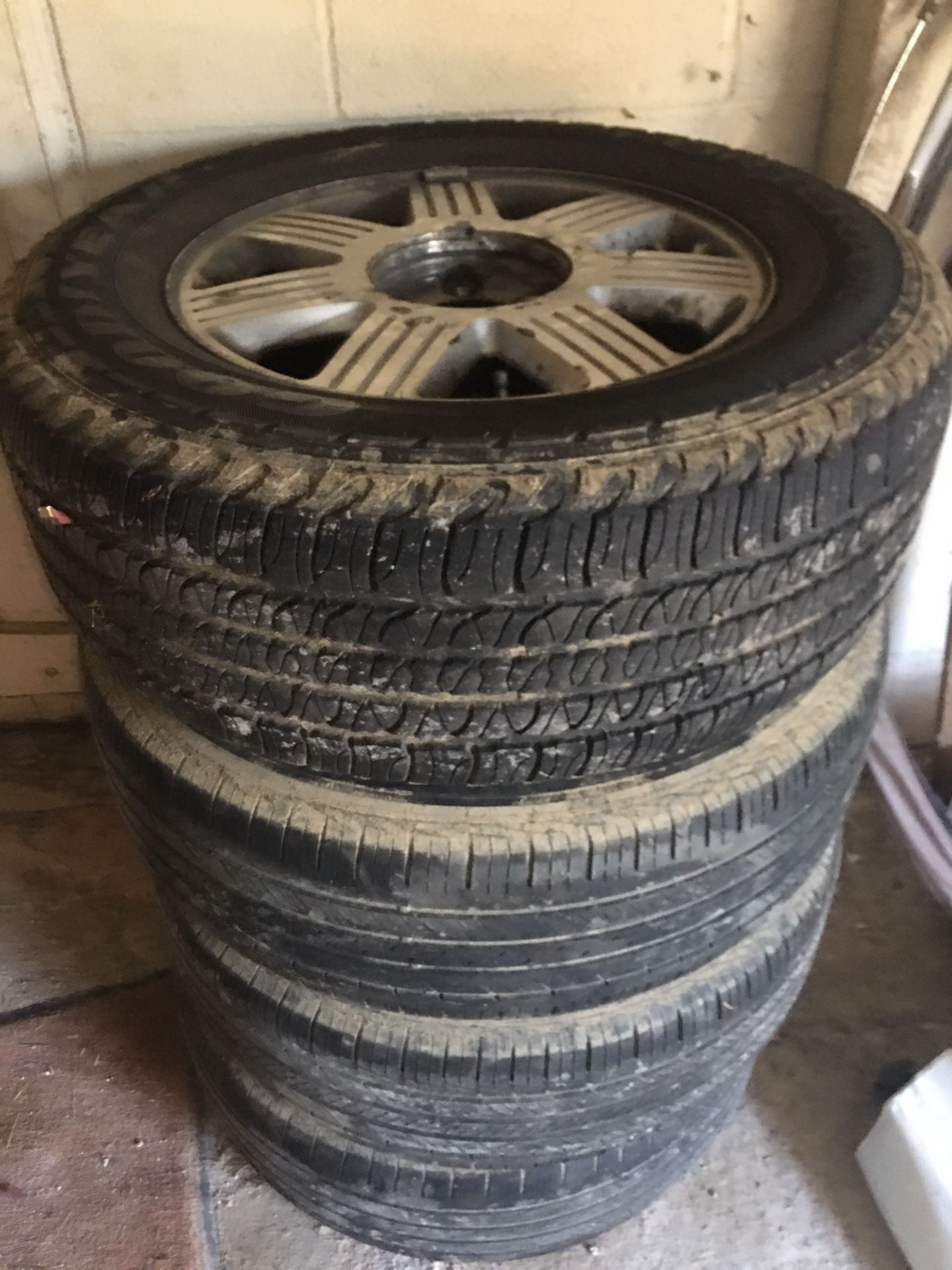 Four Tires On Aluminum Wheels Tread Good