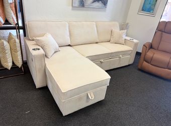 Ivory sleeper sofa with reversible storage chaise