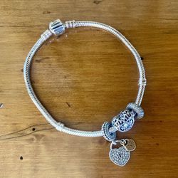 Pandora sterling silver snake bracelet with three charms