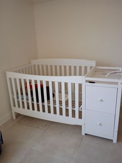 White Baby Crib with Attached Changing Table
