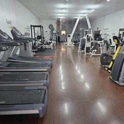 Full commercial gym equipment closing workout fitness weight machines