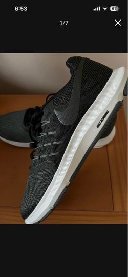 running shoes Black Low-Top Sneakers with White Sole made by Nike the size is 11 There for Man’s they are Brand New they’re running shoes
