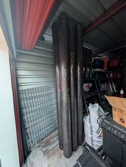 Six 6-in steel bollards 8 ft long