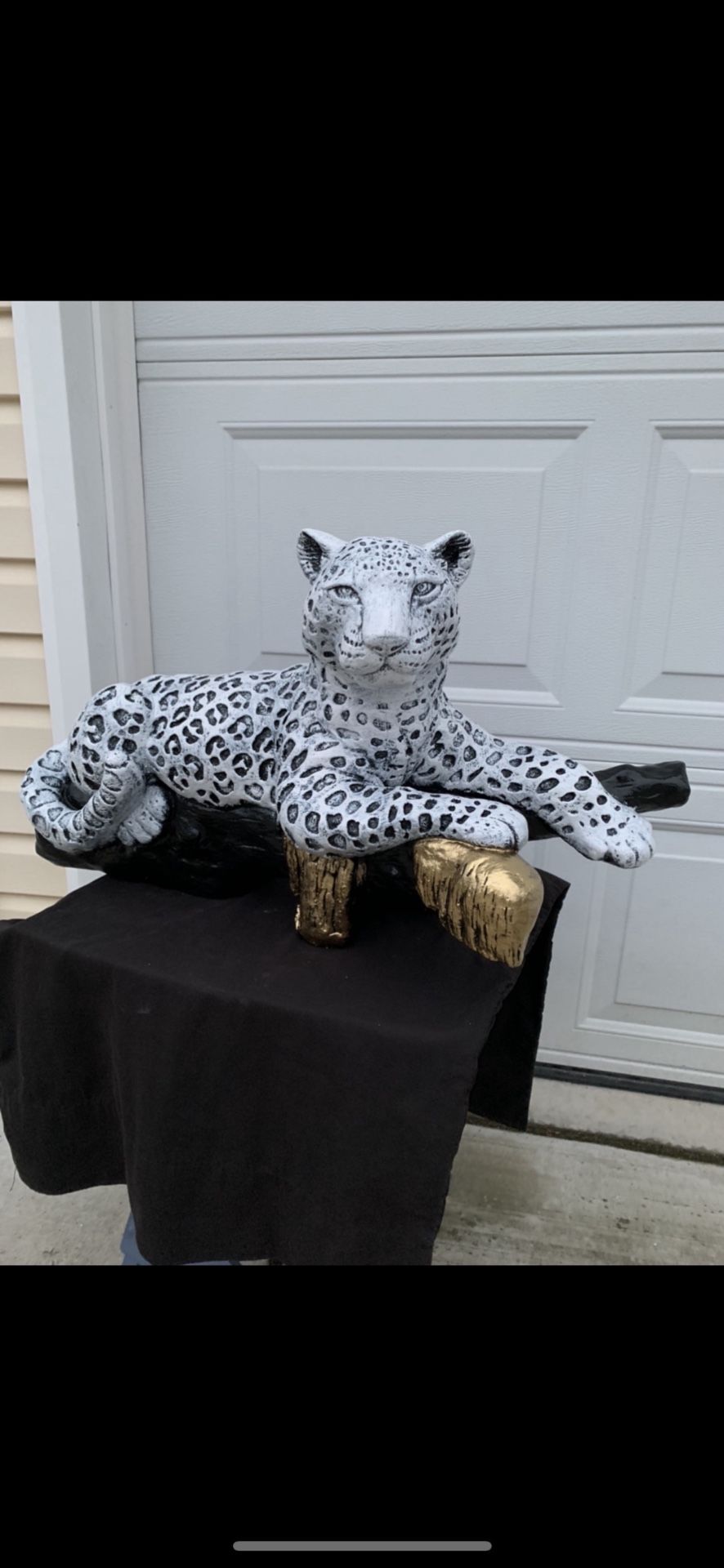 Snow Leopard On The Log Statue