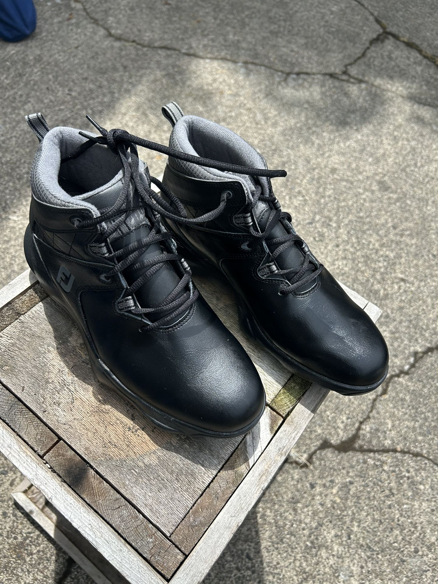 Footjoy winter golfing boots and fantastic shape. Worn one time. Excellent for golfing in the rain or muddy conditions, keep your feet dry and warm.