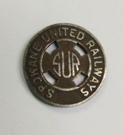 Vintage Spokane United Railway (SUR) fare token, dime sized