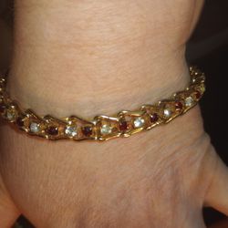 7" Gold Tennis Bracelet With Alternating Red And Clear Stones