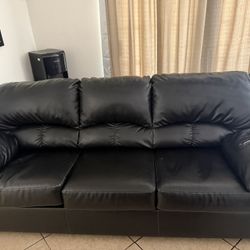 2 Sets Of Black Couches 