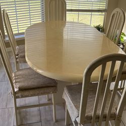 Dining table with 6 chairs and leaf
