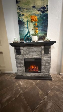 Beautiful mantel electric fireplace /tv stand in excellent condition