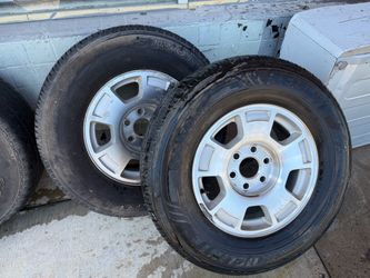 Set of 4 used 17-inch OEM aluminum rims for Chevy/GMC trucks and SUVs.