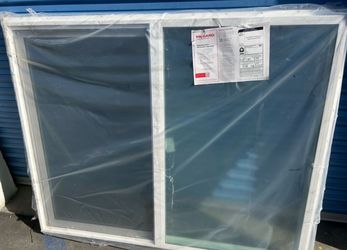 Milgard brand horizontal sliding window with a white vinyl frame 50”