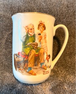 Vintage 1982 Norman Rockwell Museum porcelain mug featuring the classic illustration titled "The Cobbler".