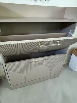 Lovely modern shoe Cabinet. Almost perfect except the top has a stain.