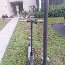 gray scooter with red  