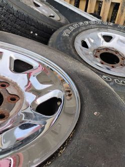 P4--- 17 inch ford 8 lug wheels 2 with tires hold air some tread Iam keeping 2 tires for my truck