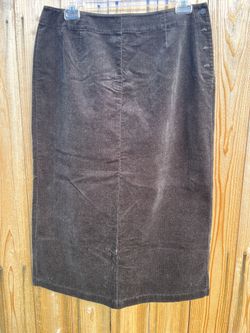 Sleek black courdroy skirt from Westbound. Straight silhouette with subtle side button accents. Smooth fabric and clean panel seams. Versatile for wor