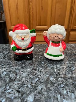 Vintage Ceramic Santa and Mrs. Claus Pair of Salt and Pepper Christmas Shakers.  Size approximately 3 1/2 inches tall.  Preowned never used.