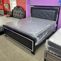 queen size bed with grey leather headboard