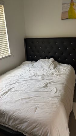 BLACK QUEEN SIZED BED