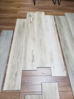 Luxury vinyl plank flooring, pets and kids friendly, sale $1.99