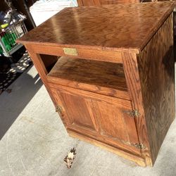 White clad cabinet all wood original can use for a tv stand  or anything has a door opens storage ,has shelf ,all mechanisms work perfect . 28 long — 