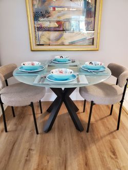Glass top dining table with chairs