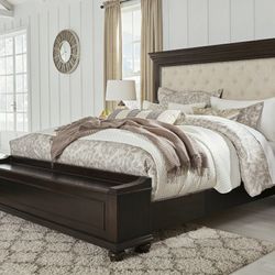 Brynhurst Dark Brown King Upholstered Storage Bed

