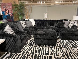 Large 3 piece Sectional features luxuriously soft jumbo corduroy fabric