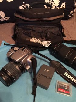 Canon camera bundle with 18-55 lens, 75-300 lens, San disk memory card, battery charger, strap and bag