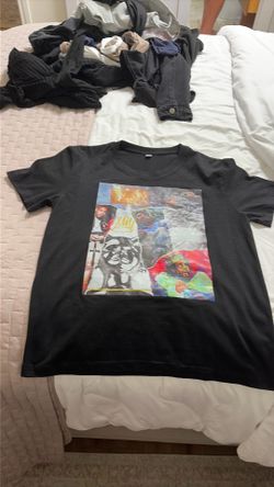 J Cole T shirt size medium color black.