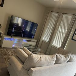 75” Samsung TV  and a Tv stand 