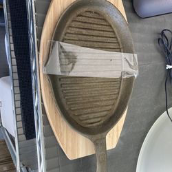 Cast iron new with wood base new