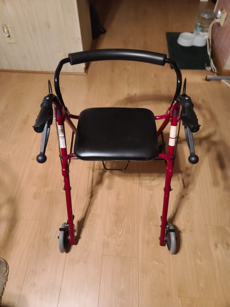 ROLLATOR WITH HAND BRAKES AND PADDED SEAT
