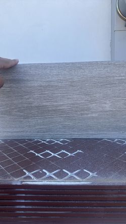Grey ceramic tile.