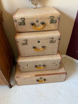 Set (4) matching antique suitcases.