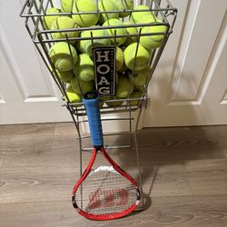 Tennis ball hopper and a Wilson racket
