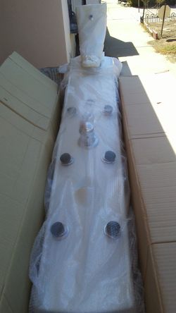 New Shower panel with 6 jets plus shower head, hand sprayer, shampoo tray. Never installed.